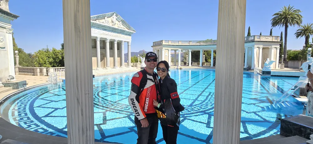 Attendees beside the colonnade of the Neptune Pool at Hearst Castle