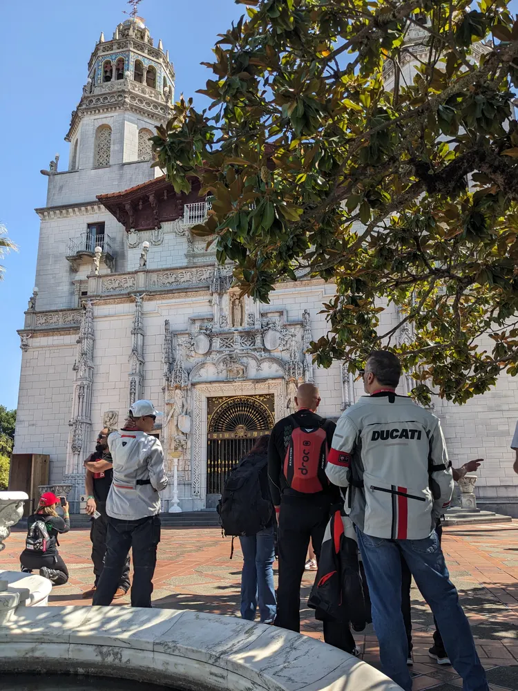 The CADW 2025 tour group outside the main facade of Hearst Castle