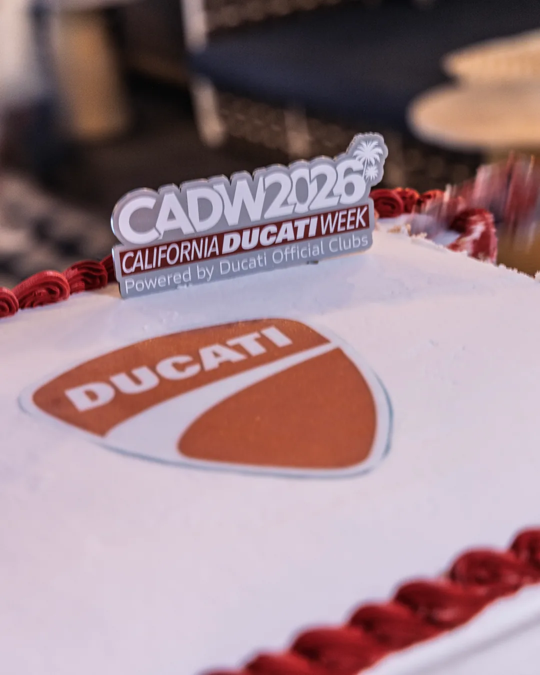 The Ducati celebration cake with the CADW 2026 topper at the gala.