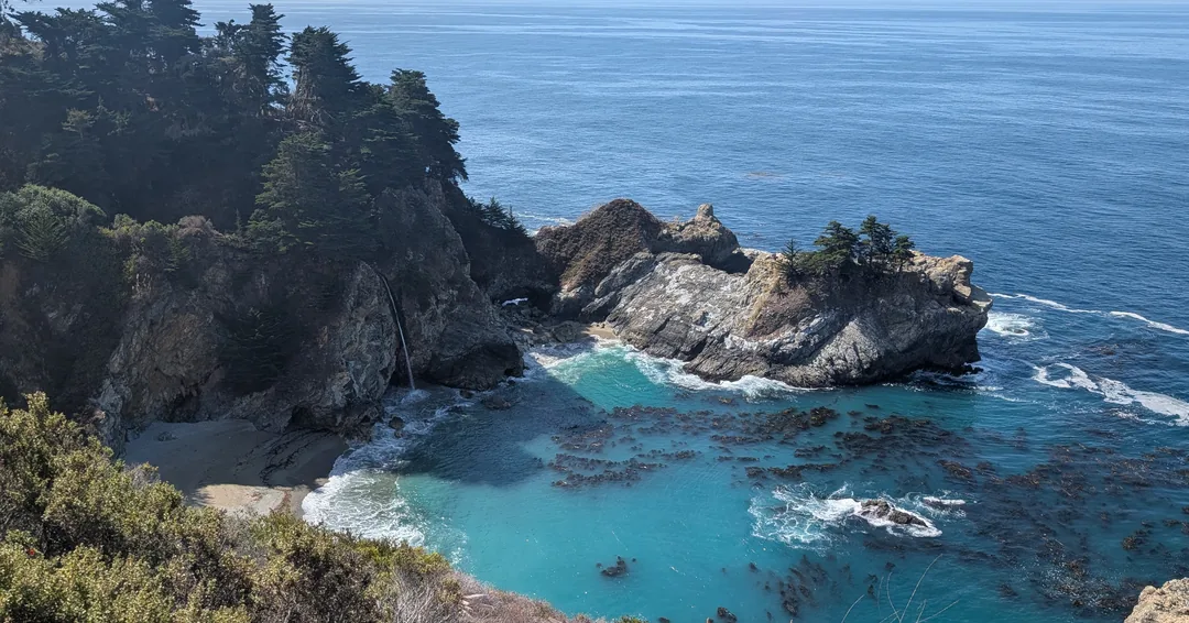 Turquoise water and rocky cliffs along the Northern California ride to CADW 2026.
