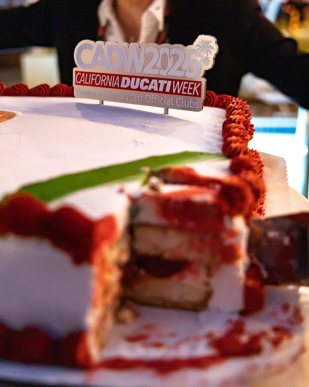 A slice cut from the red and white celebration cake at the Friday gala.