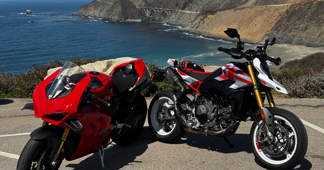 Two Ducati motorcycles parked above the ocean on the Saturday Pacific Coast Highway ride.