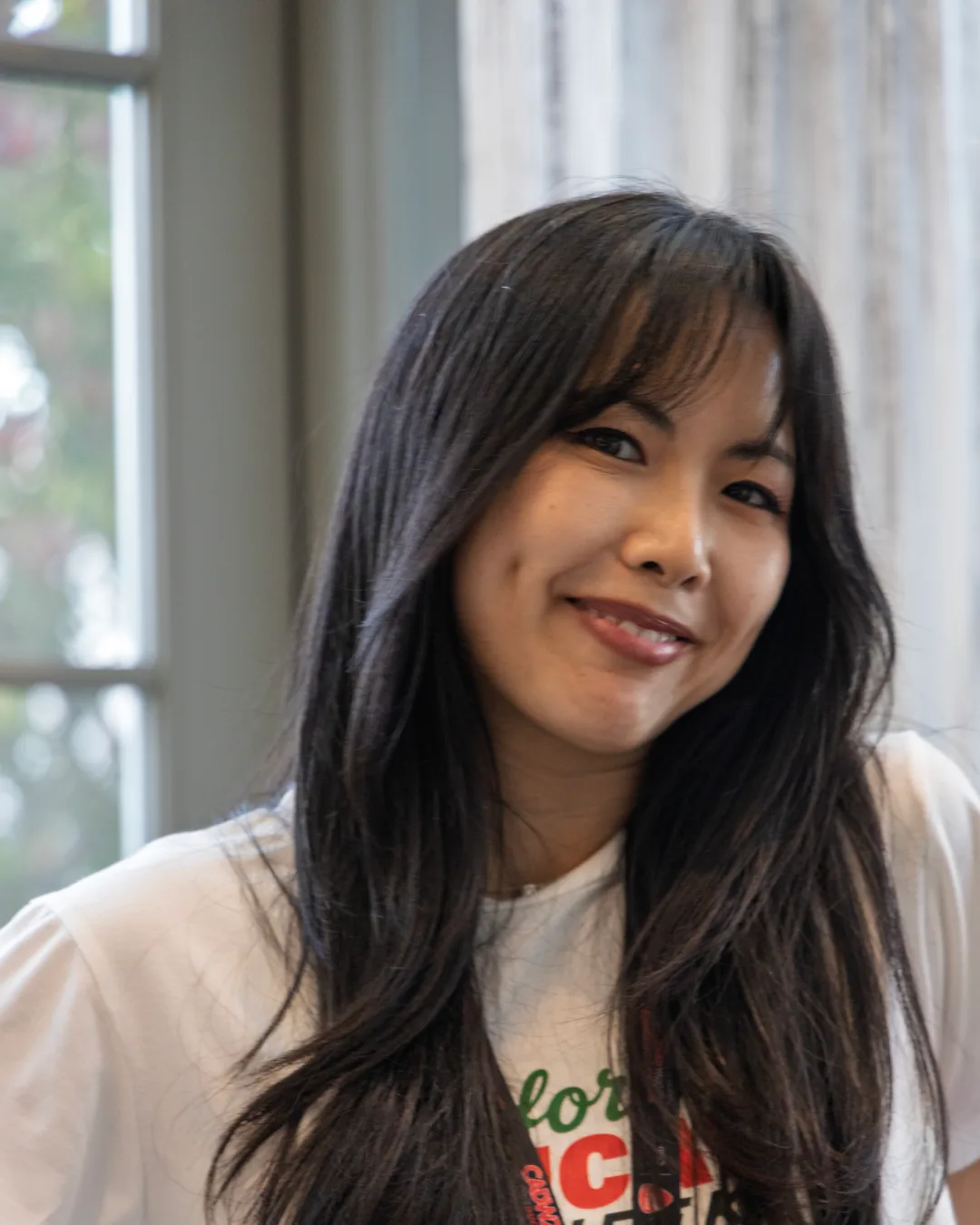 An attendee smiling during the Saturday workshop.