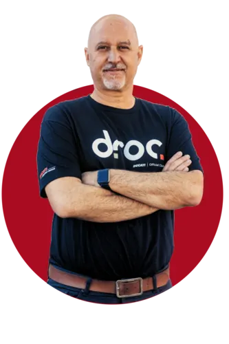 Filippo Pagan, Vice President of Ducati Riders of Orange County, arms folded in a DROC club shirt